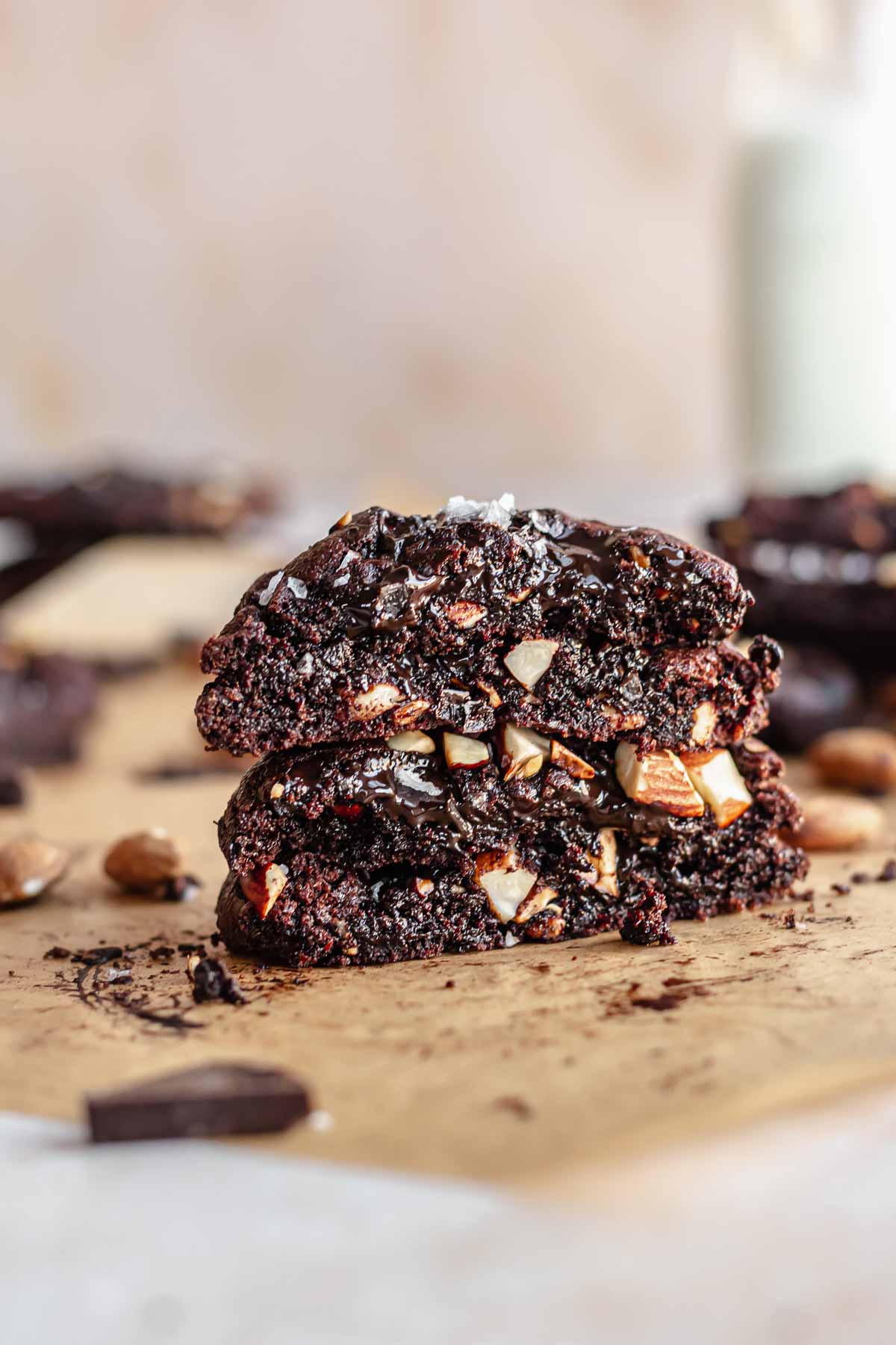 A stack of cut open gooey chocolate almond cookies.