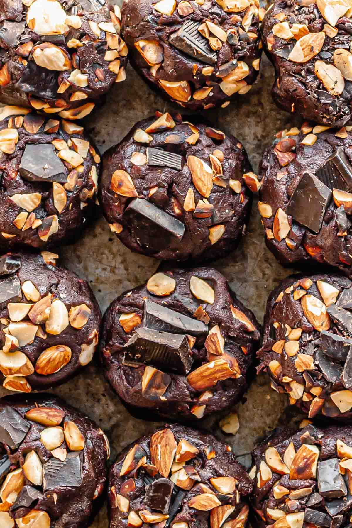Cookie dough balls with chocolate and almond toppings.