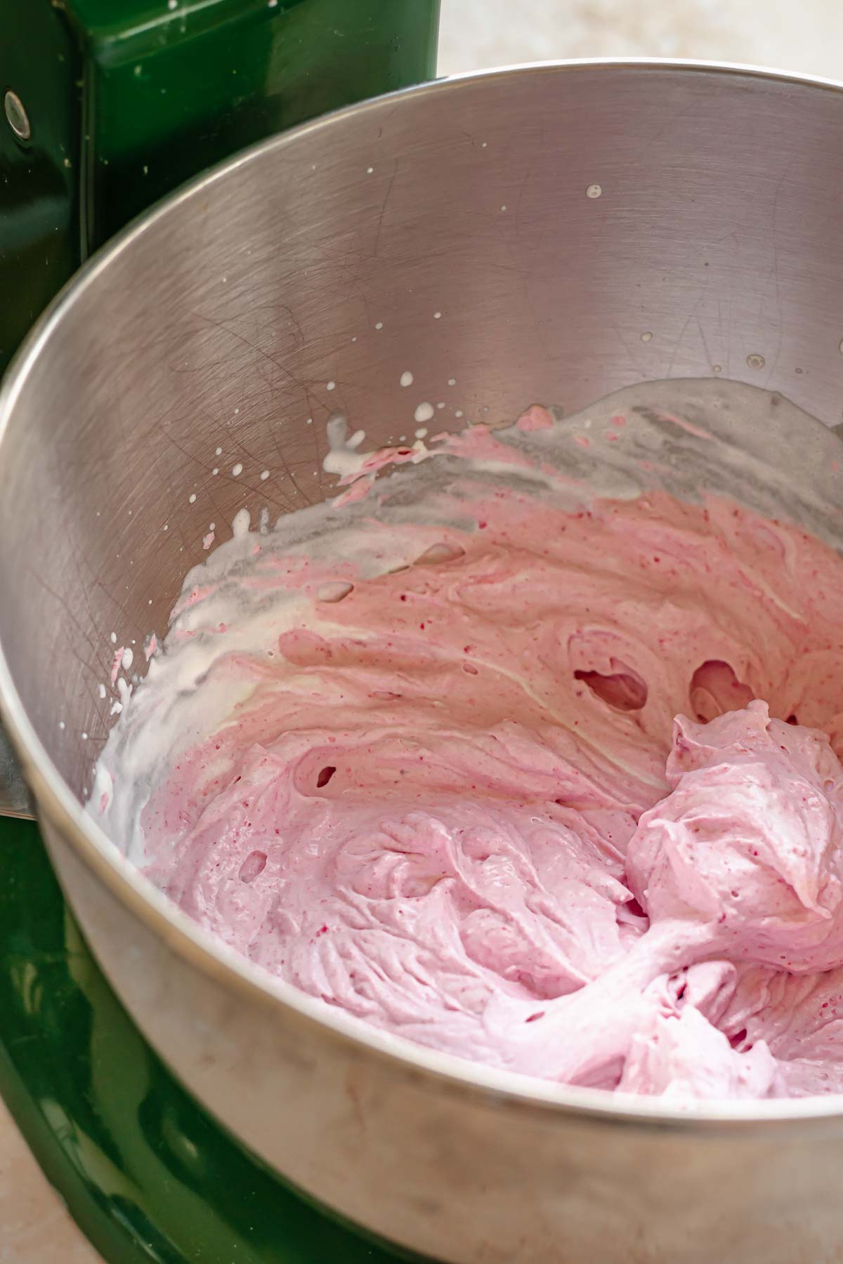Raspberry whipped cream in a bowl.