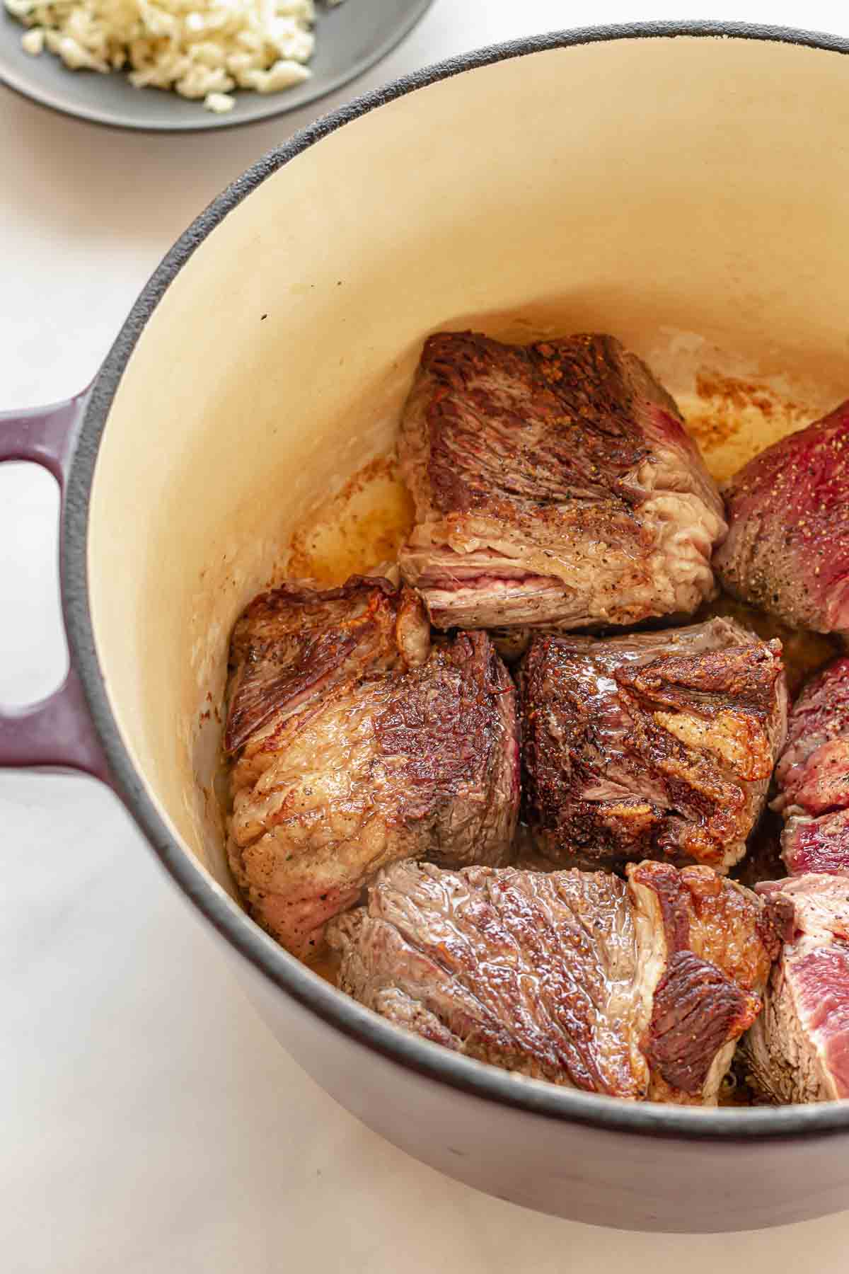 Chuck roast browning in a pot.