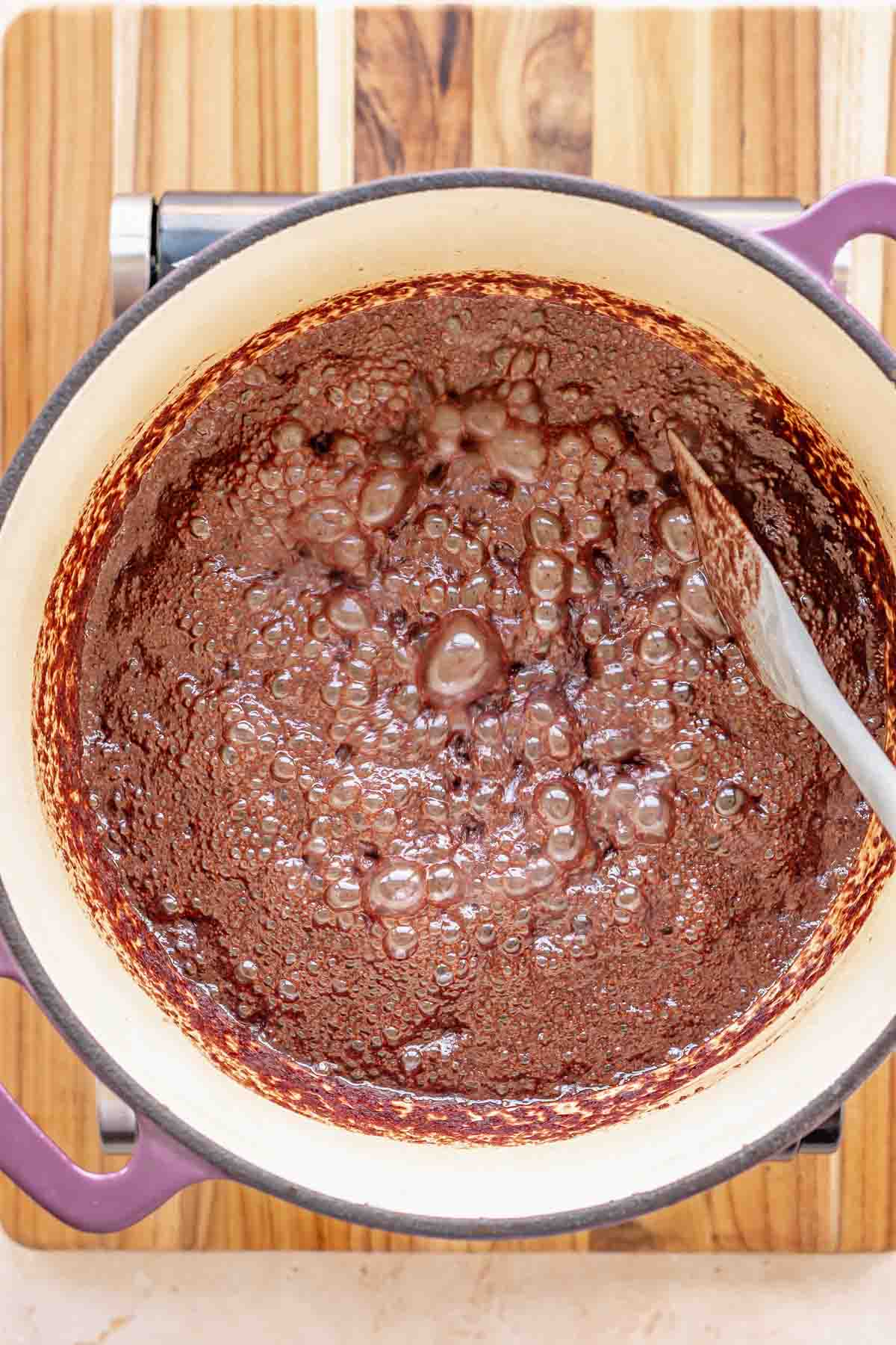 Chocolate mixture bubbling in a pot.
