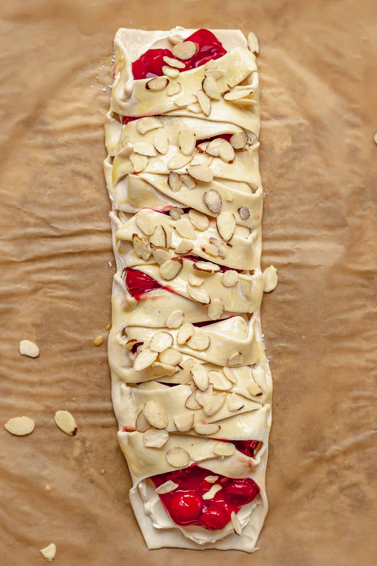 Sliced almonds sprinkled on top of the pre-baked danish.