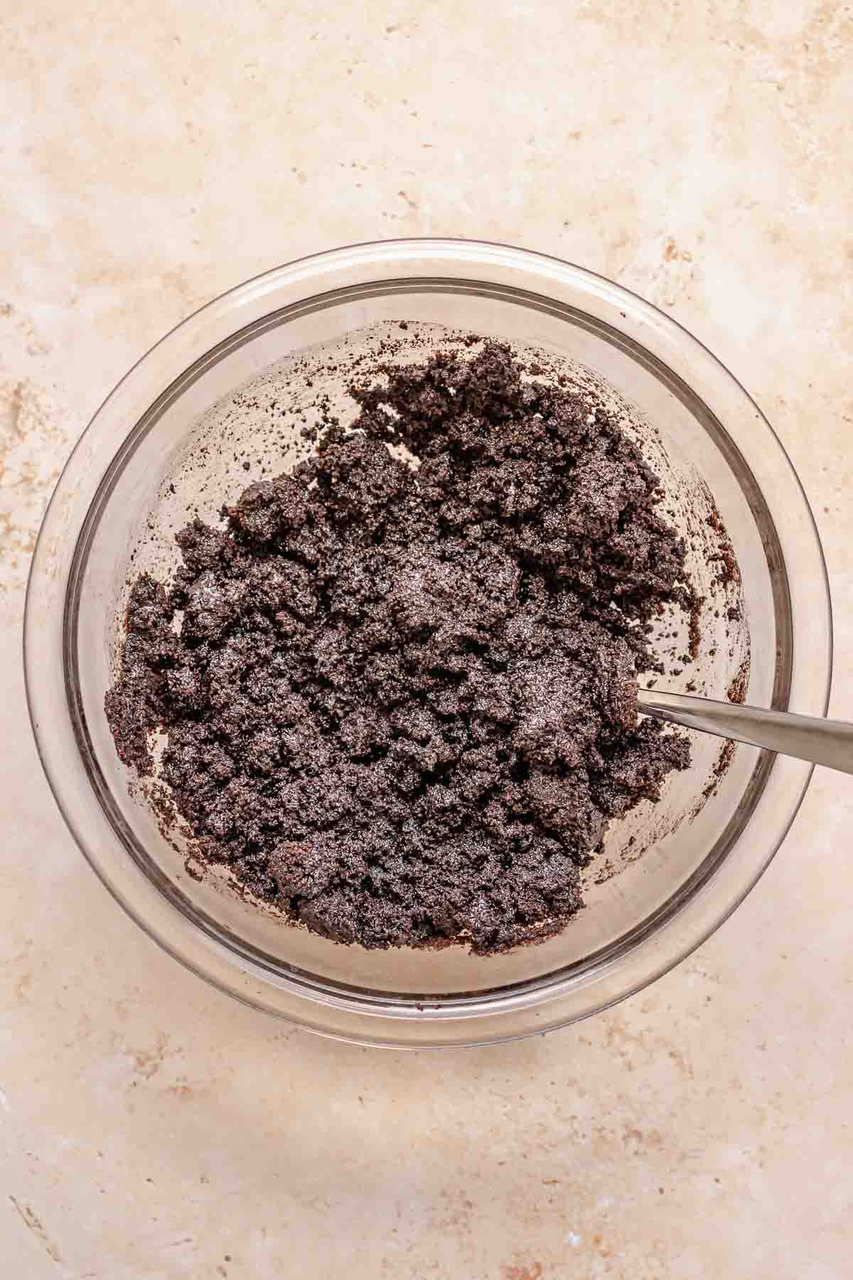 Oreo crust mixed in a bowl.