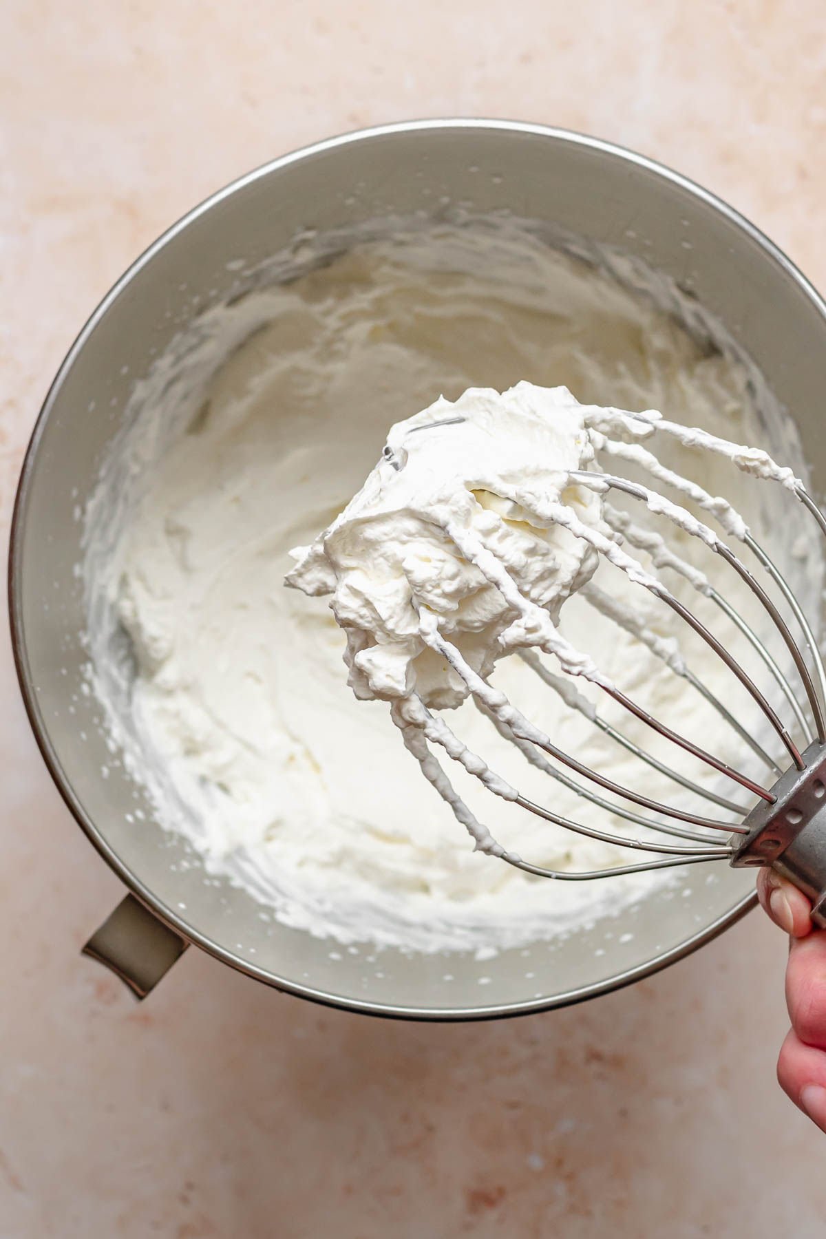 Whipped cream on a whisk.