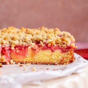Rhubarb crumb cake sliced open to show the inside.