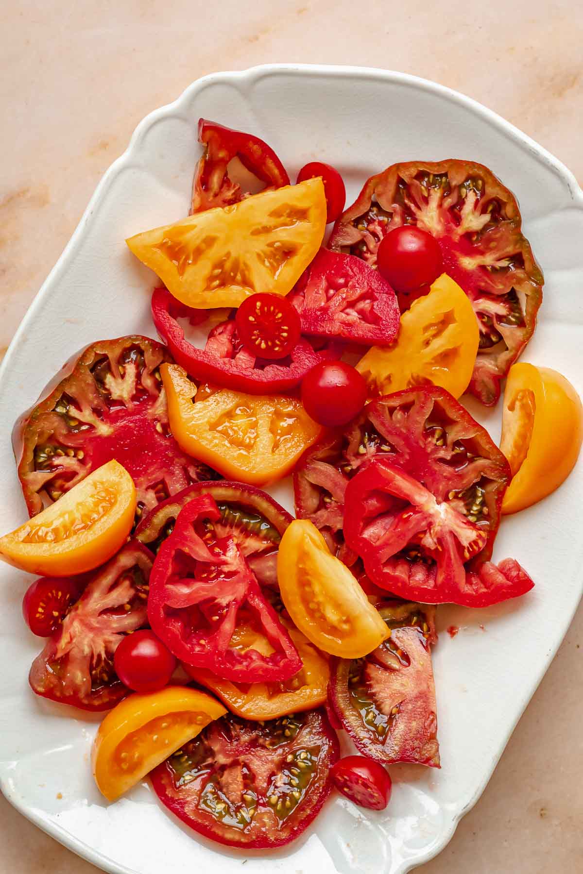 Sliced tomatoes arranged on a platter.