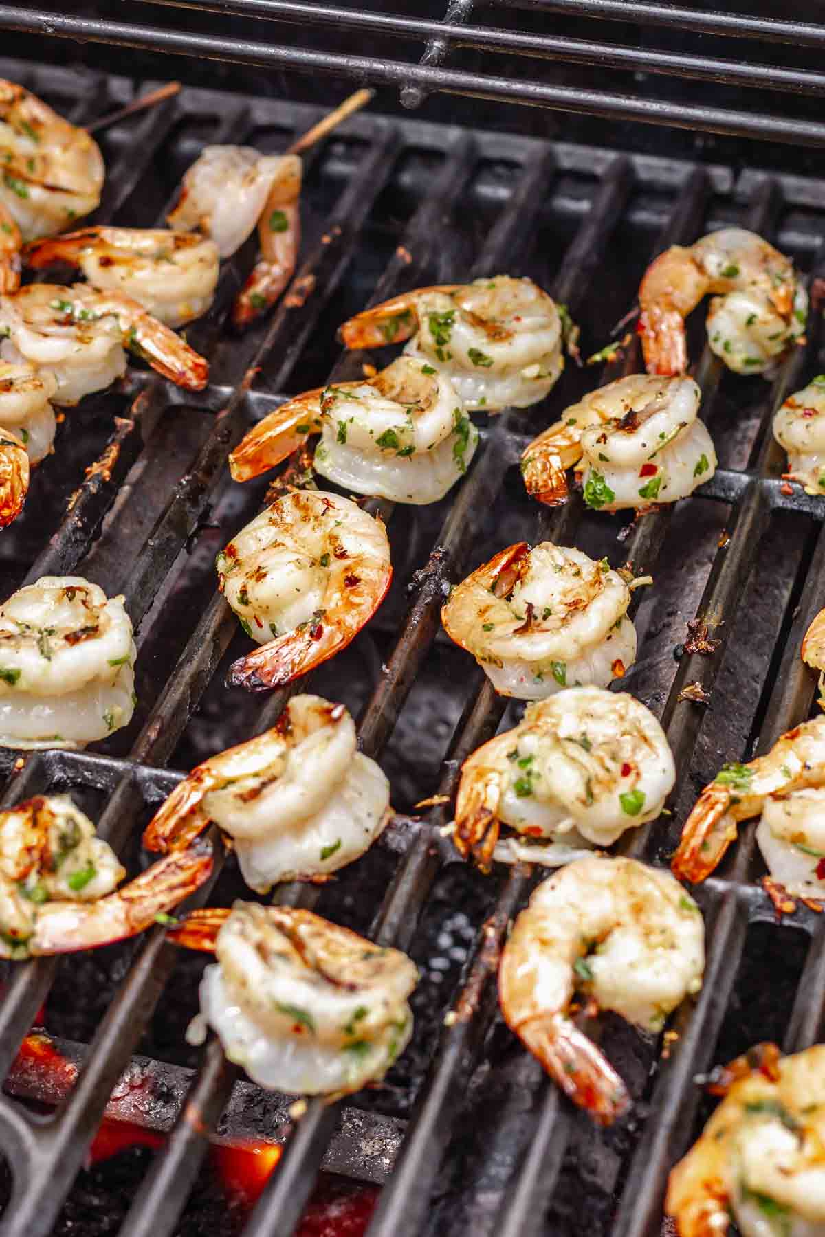 Shrimp cooking on a grill.