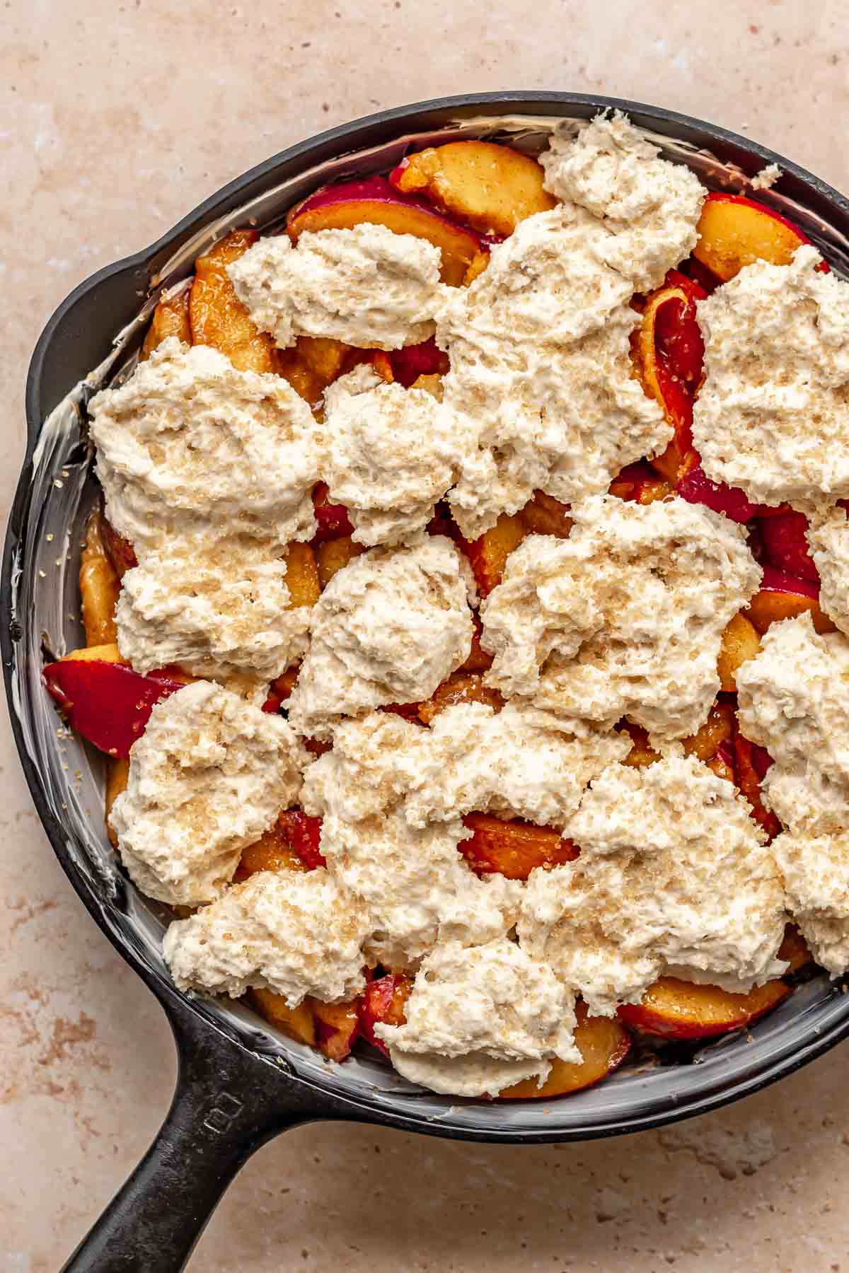 https://thecozyplum.com/wp-content/uploads/2023/07/skillet-peach-cobbler-process-8.jpg