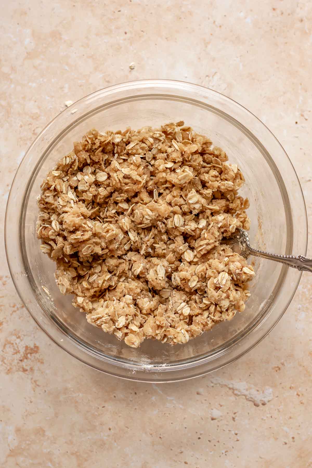 Streusel topping in a bowl with a fork.