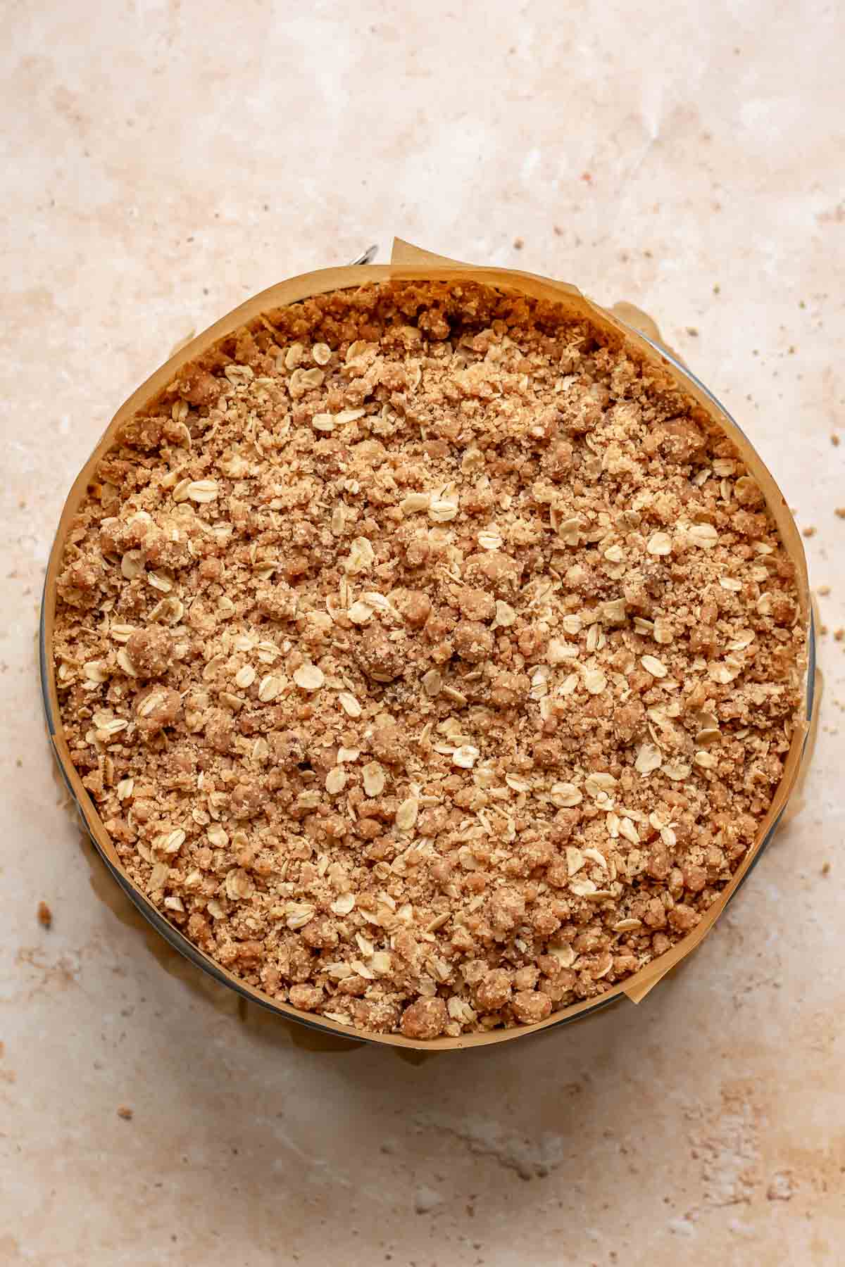 Crumble topping on top of cheesecake batter.