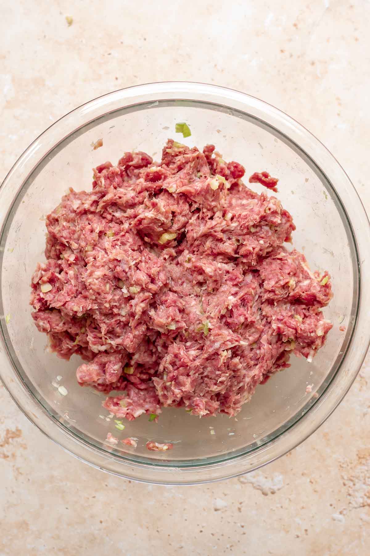 Mixed meatball meat in a bowl.