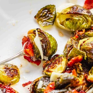 Maple bacon brussels sprouts speared on a fork.