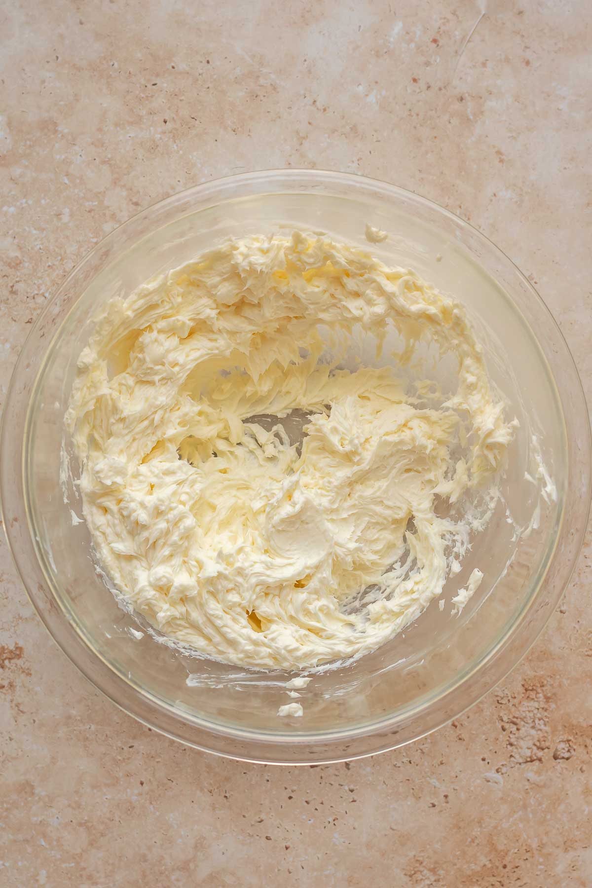 Creamed butter and cream cheese in a bowl.