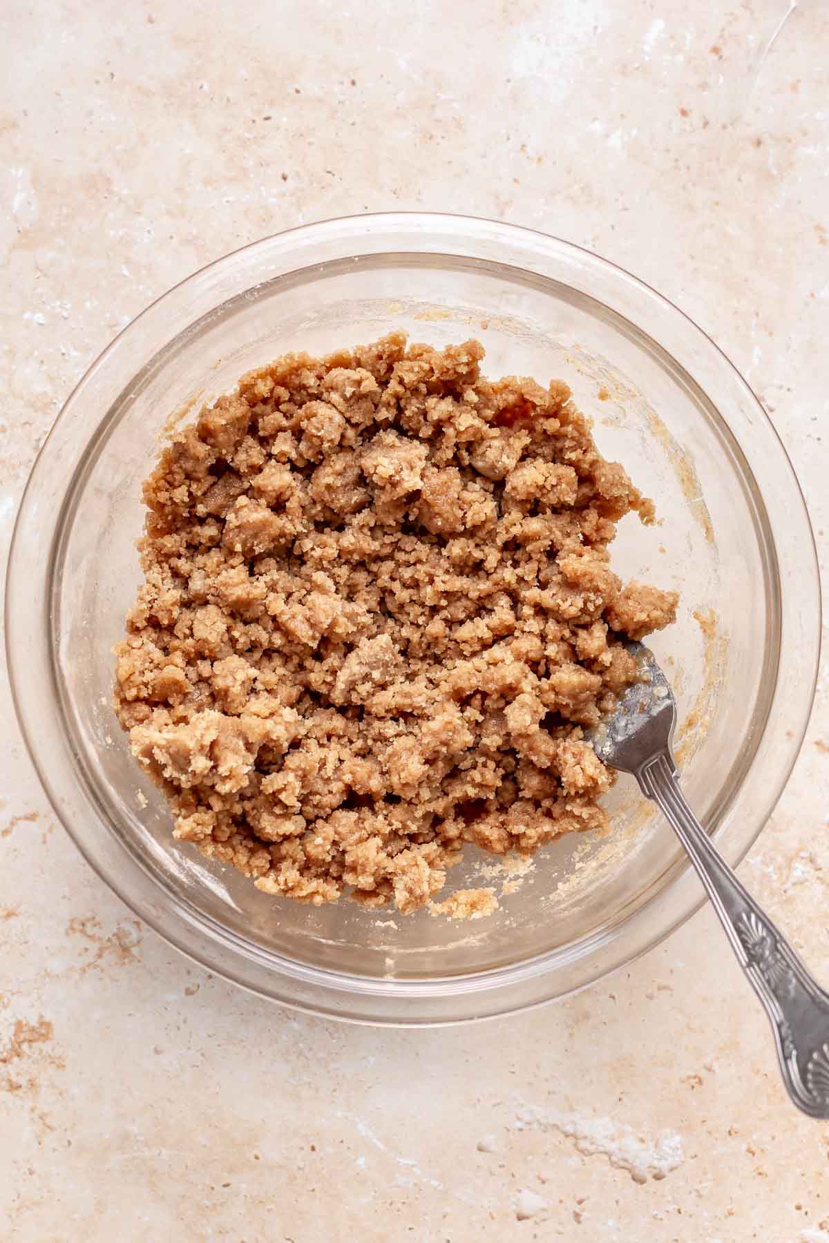 Streusel topping mixed in a bowl with a fork.