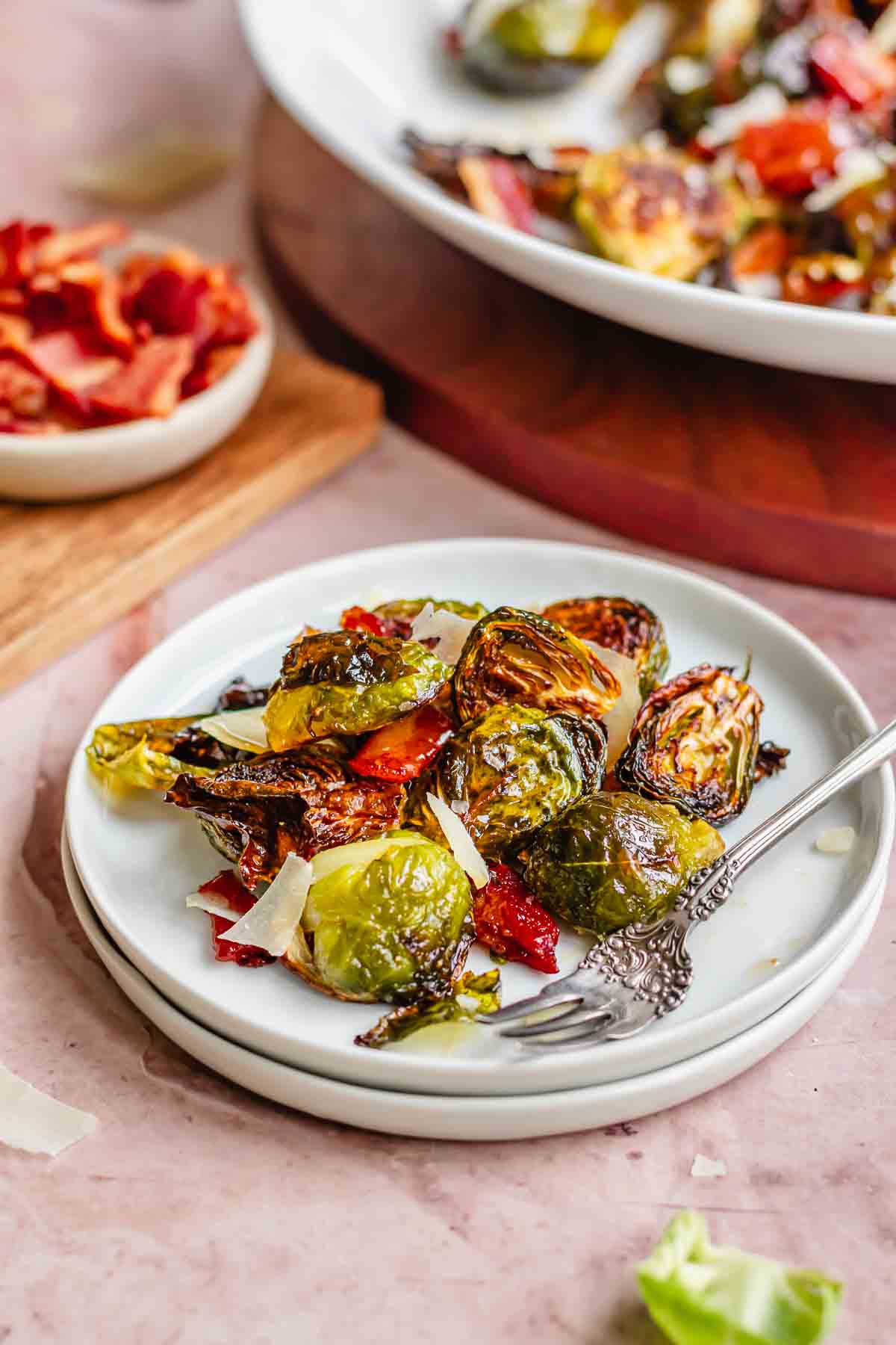 Maple bacon brussels sprouts on a plate with a fork.