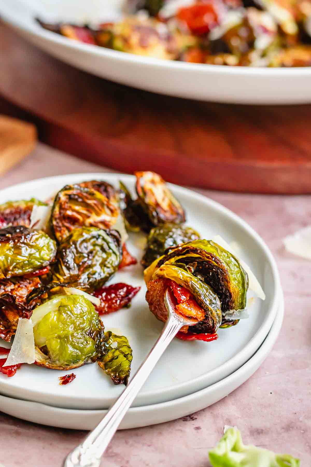 Maple bacon brussels sprouts speared on a fork.