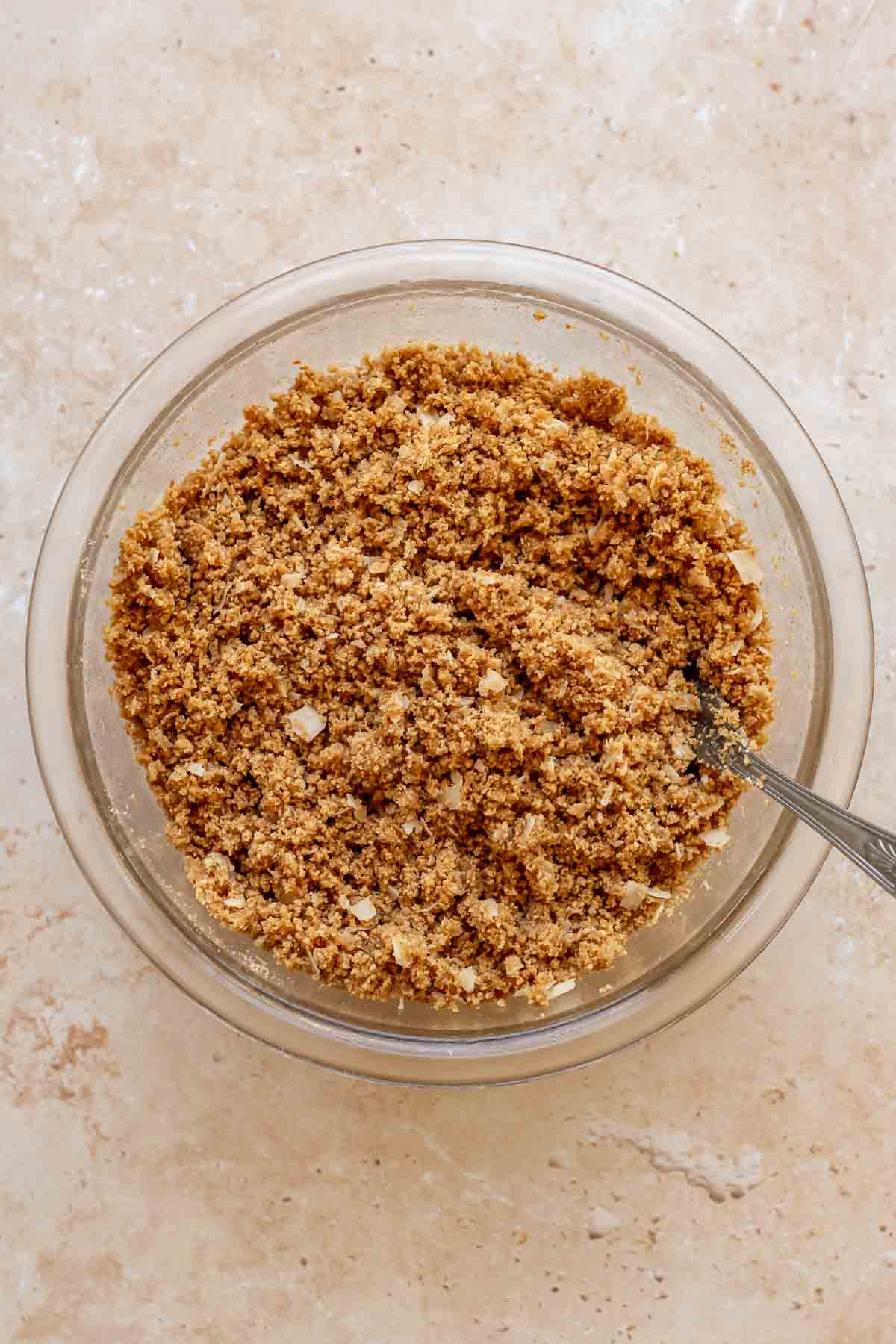 Graham cracker crust mixed together in a bowl.