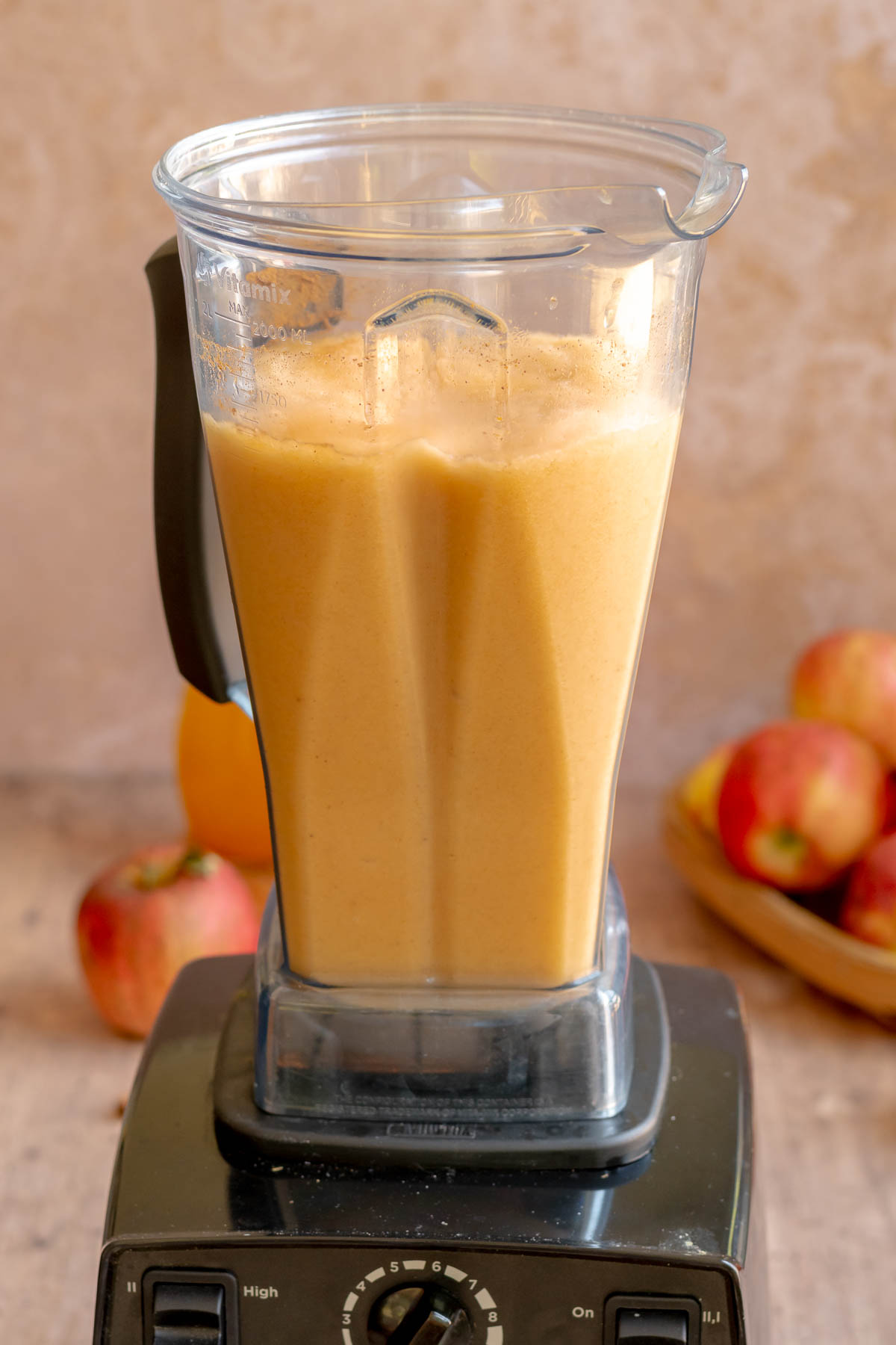 Blended apple cider slushie in a blender.