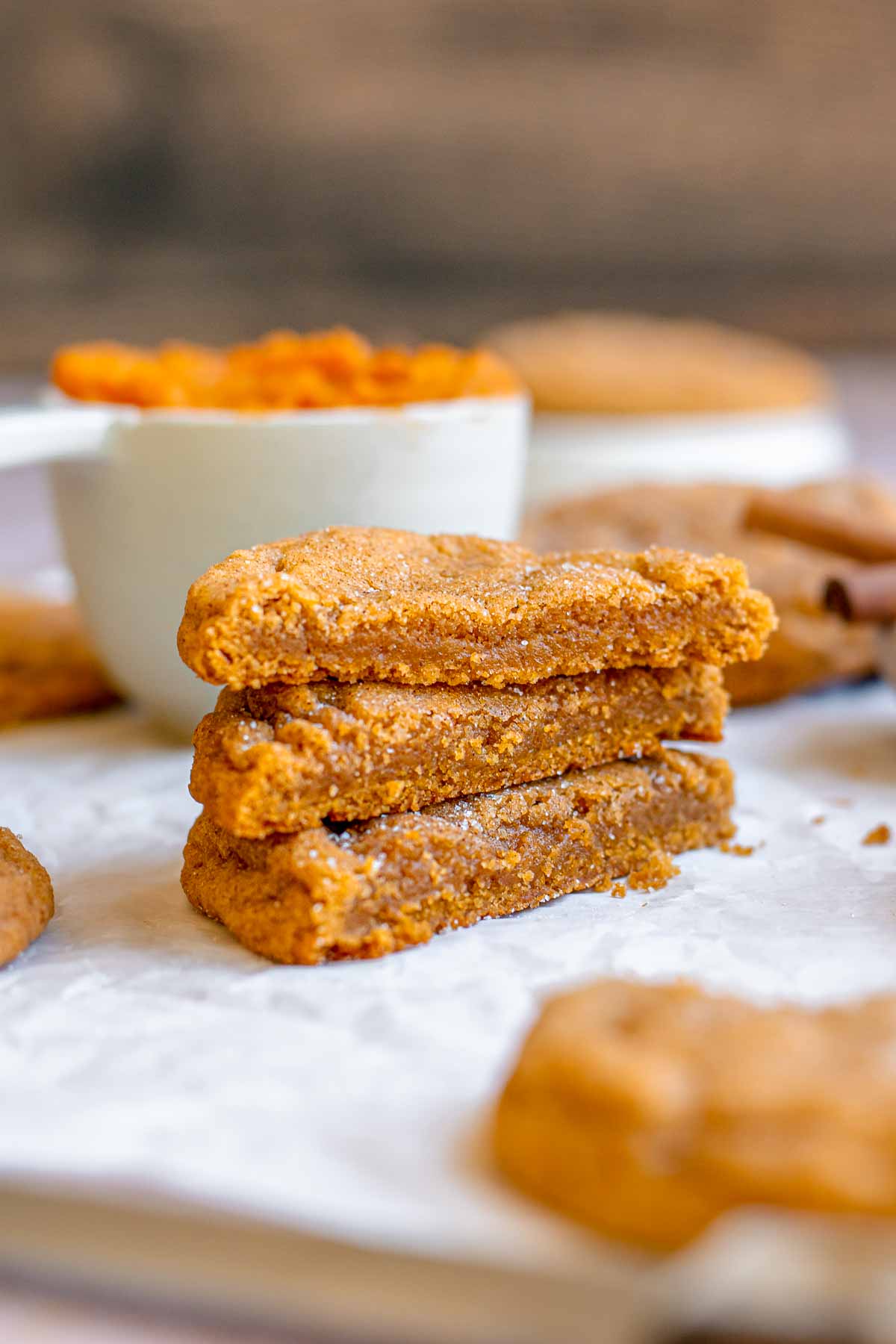 Pumpkin cookies cut in half and stacked on top of each other.