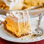 A slice of pumpkin mousse pie on a plate.