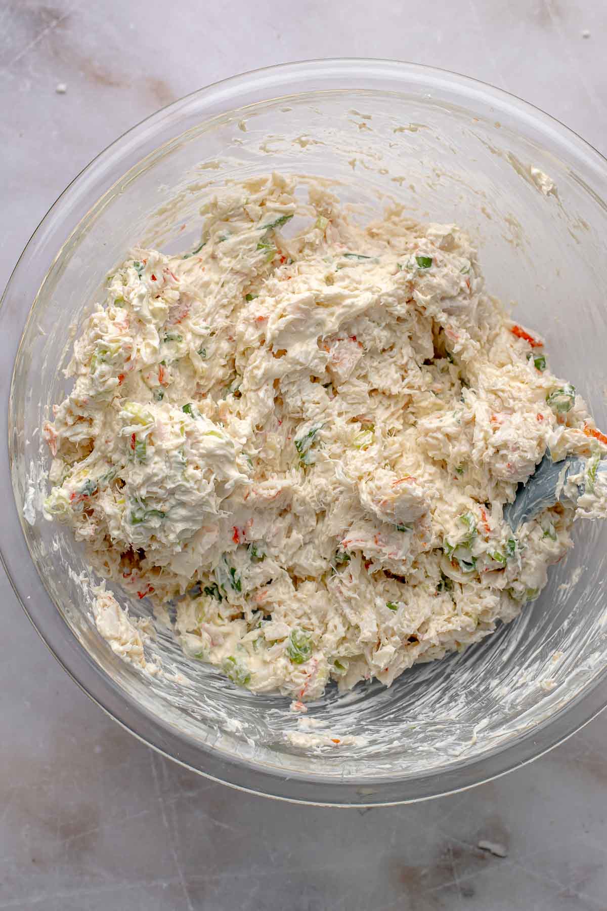 Crab filling ingredients mixed together in a mixing bowl.