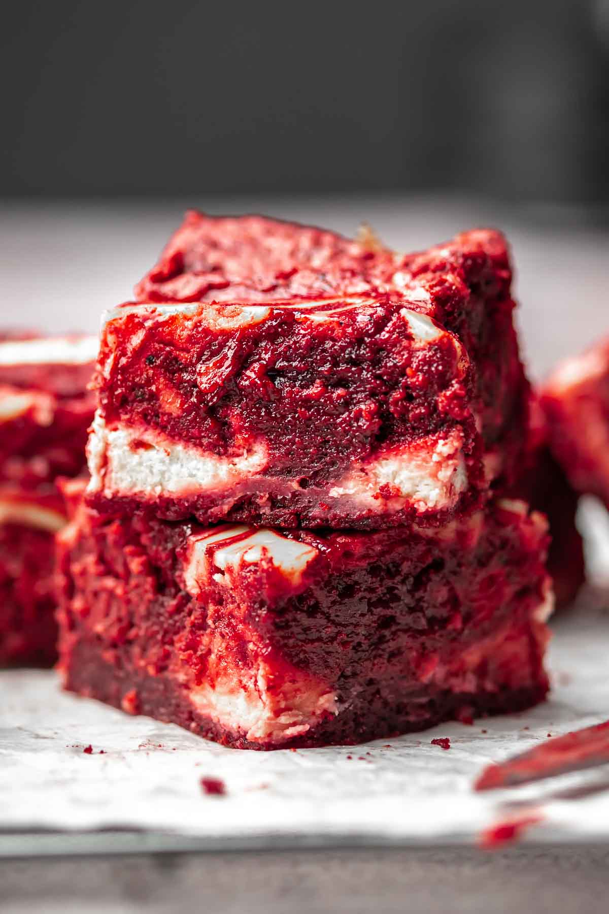 Stack of two red velvet brownies on top of each other.