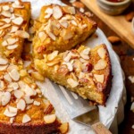 Honey almond cake sliced on a platter.