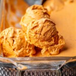 Scoops of ice cream on top of the dish of ice cream.