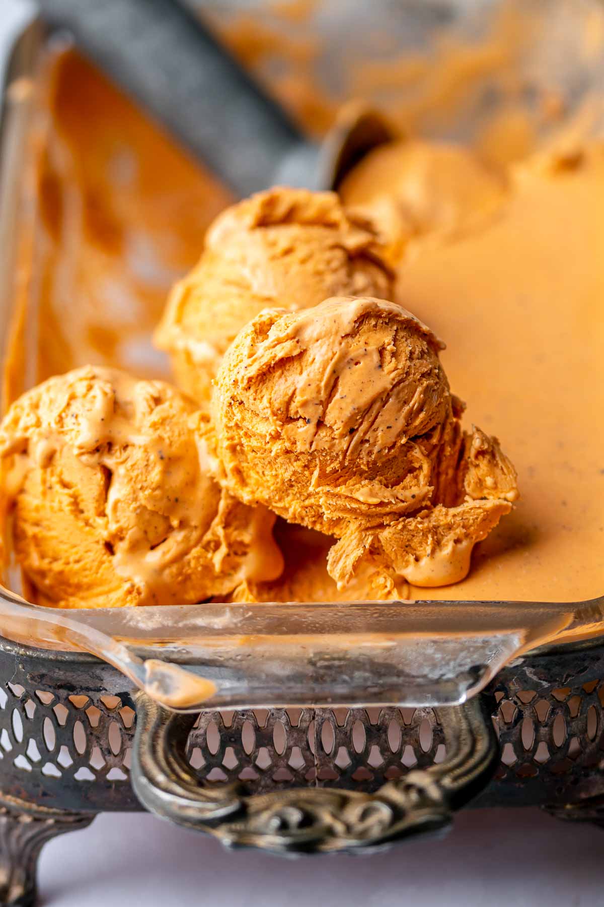 Scoops of ice cream on top of the dish of ice cream.