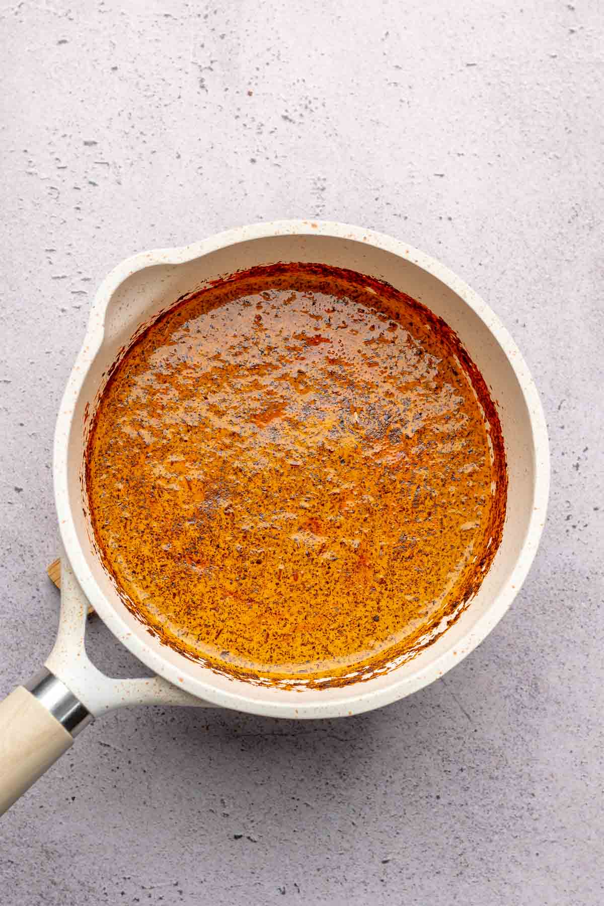 Thai tea steeping in a pot.