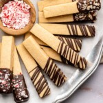 Cookie sticks layered on a plate.