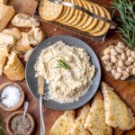 Fromage fort in a bowl with dippers around.