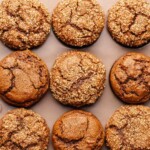 Baked gingerbread muffins in a muffin tin.