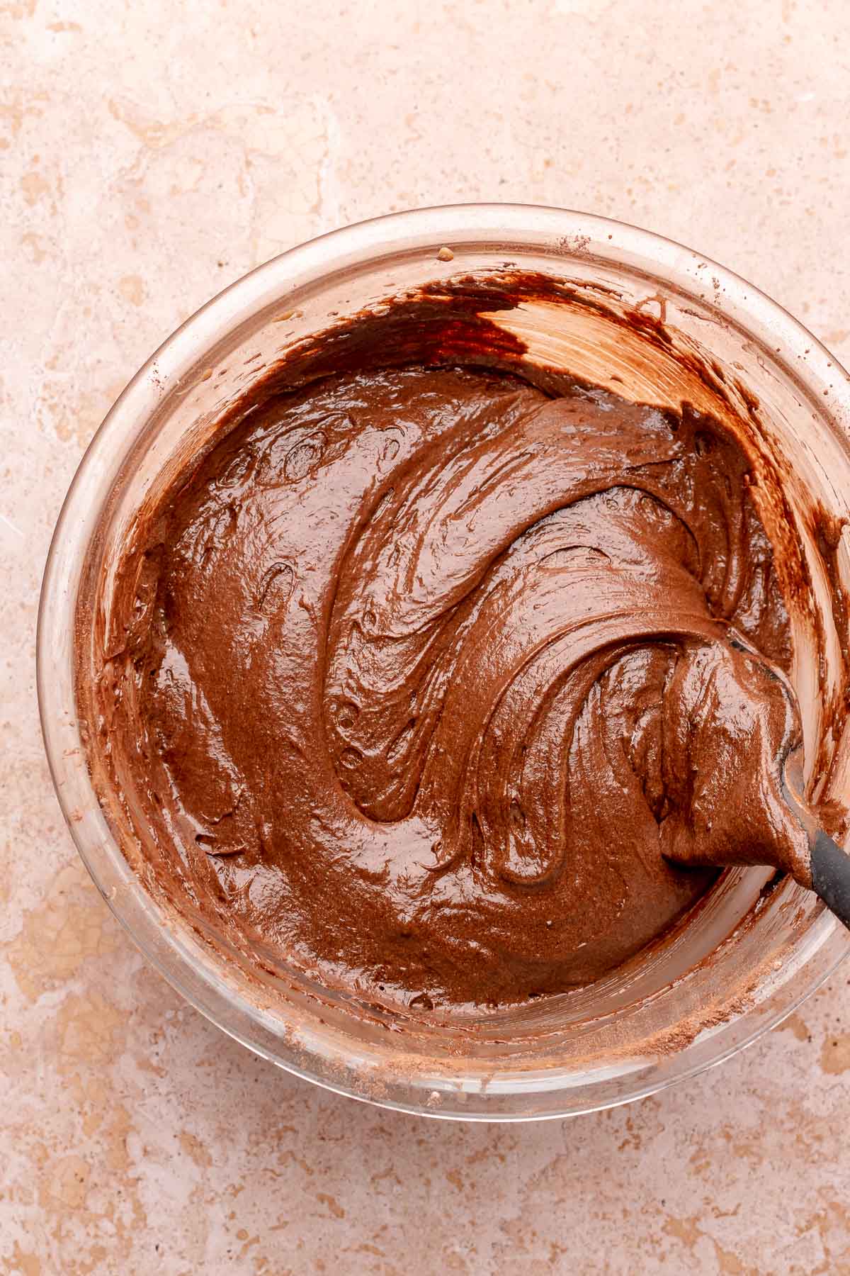 Chocolate cake batter in a bowl.