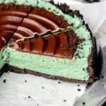 Sliced chocolate mint pie on a platter.
