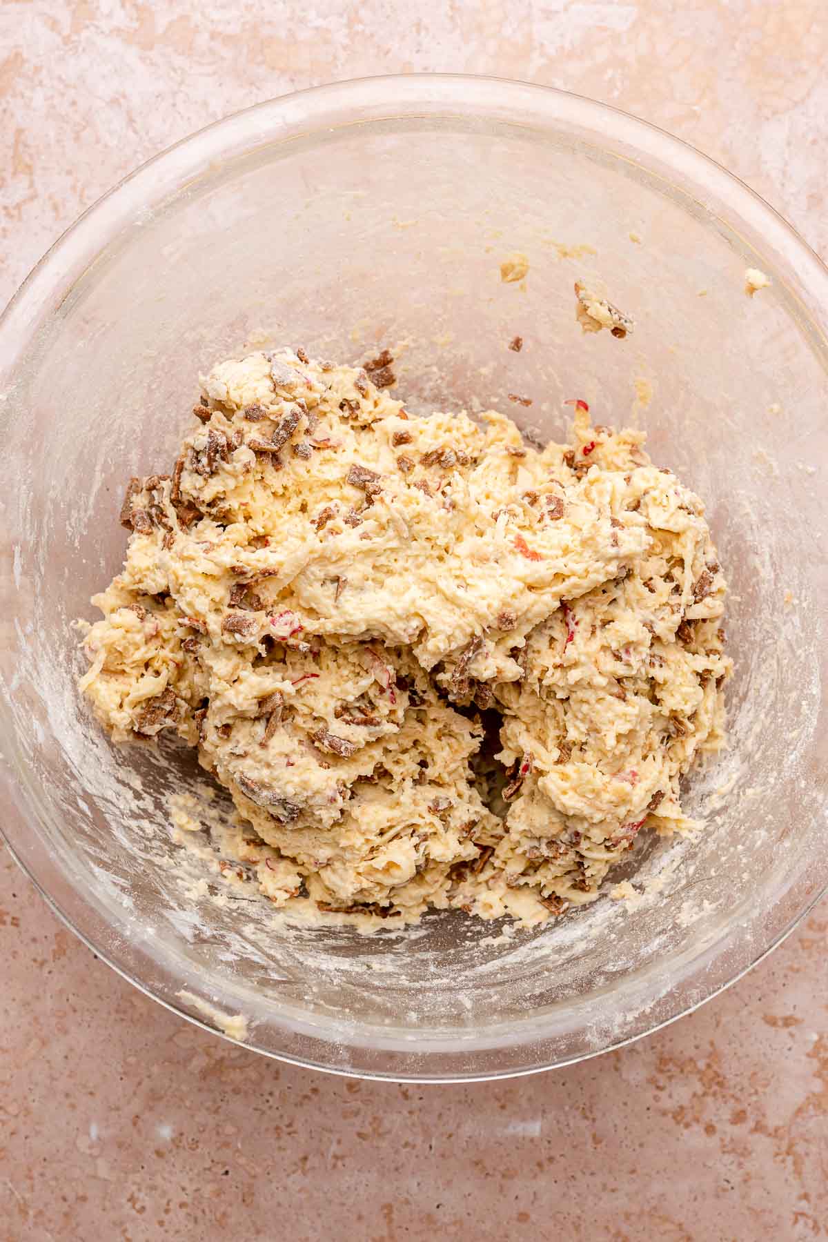 Mixed apple cinnamon scone dough in a bowl.
