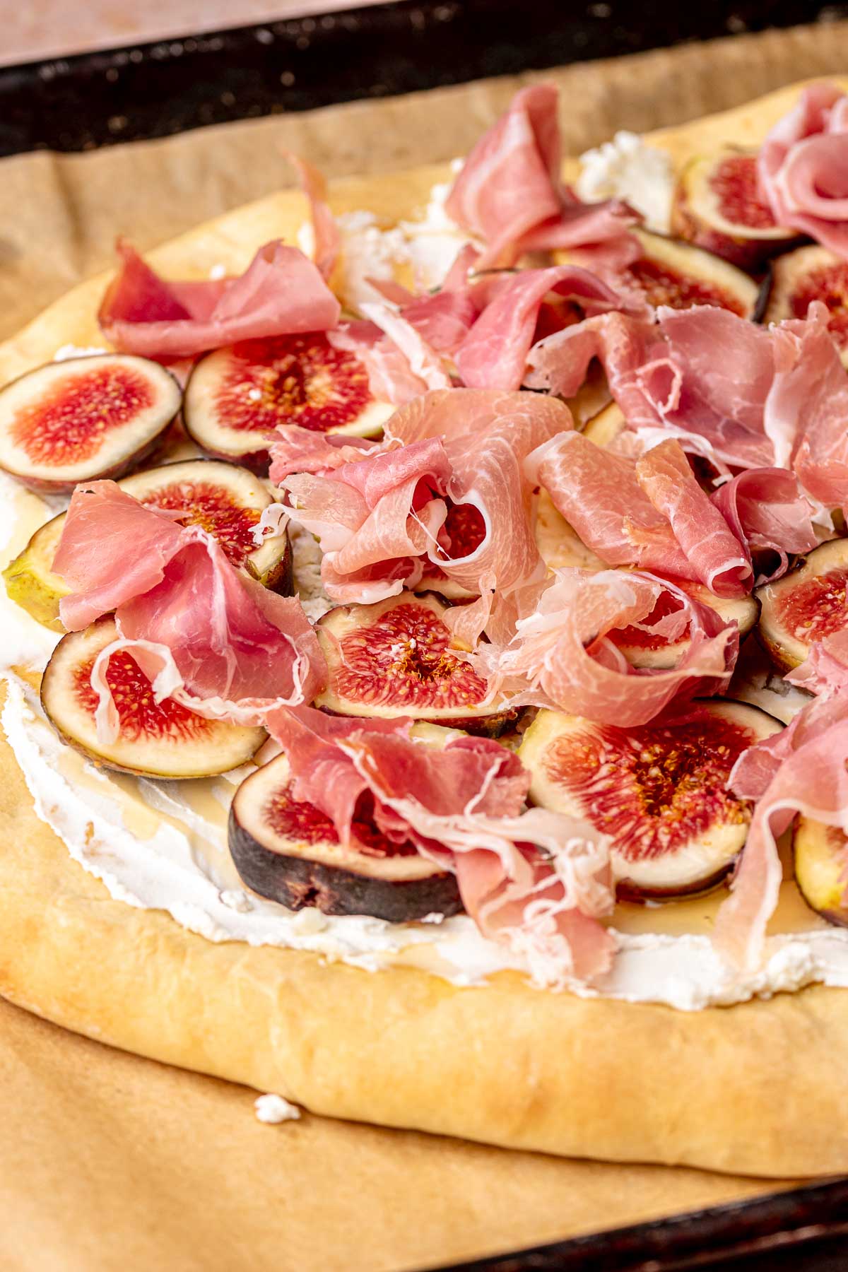 Prosciutto bunders on top of fig slices and goat cheese.