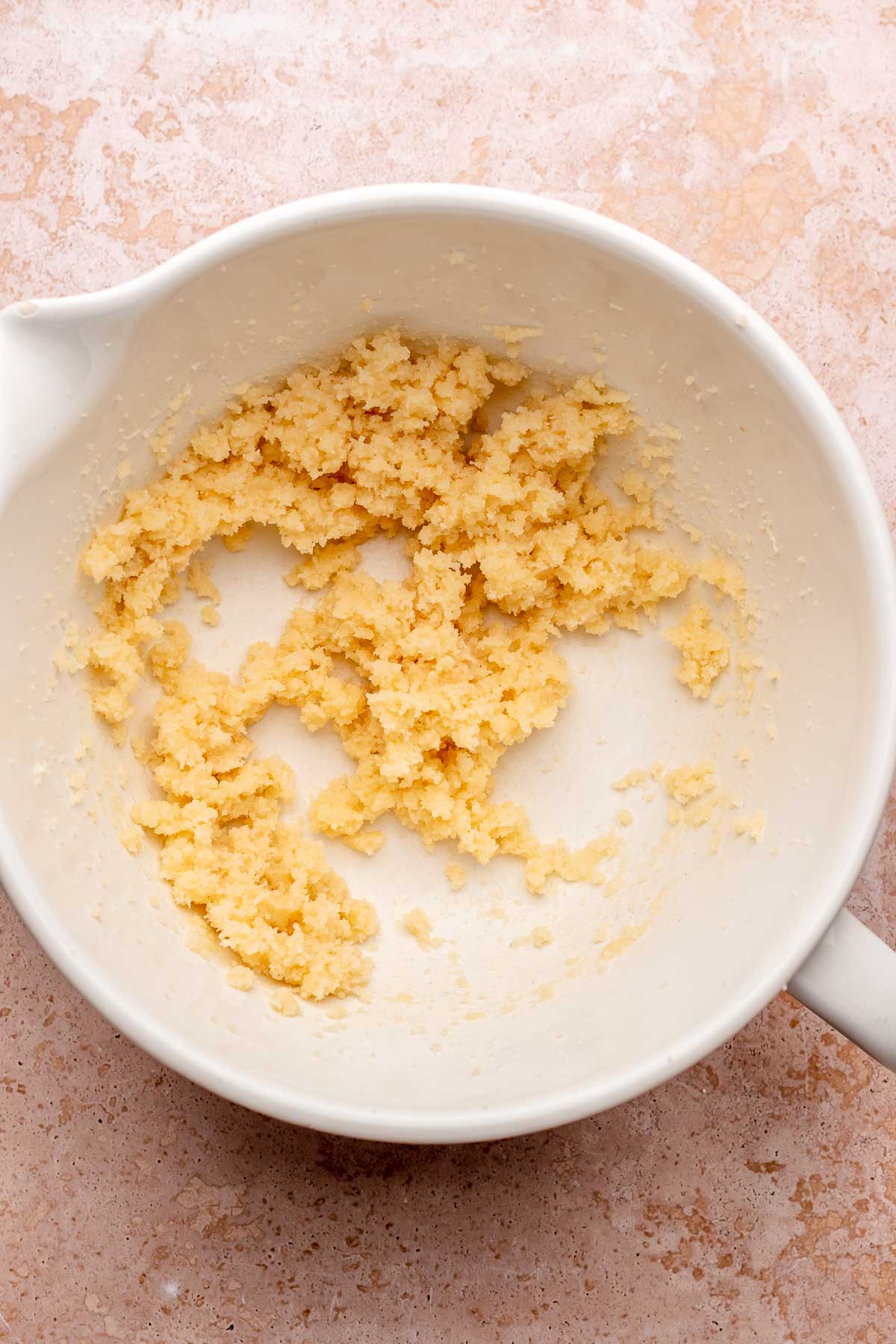 Creamed butter and sugar in a bowl.