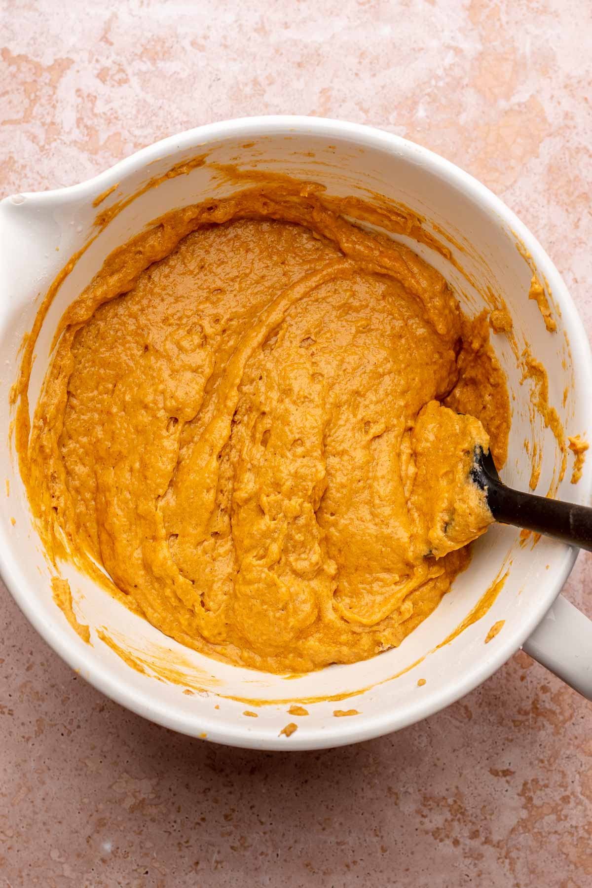 Finished pumpkin cake batter in a bowl.