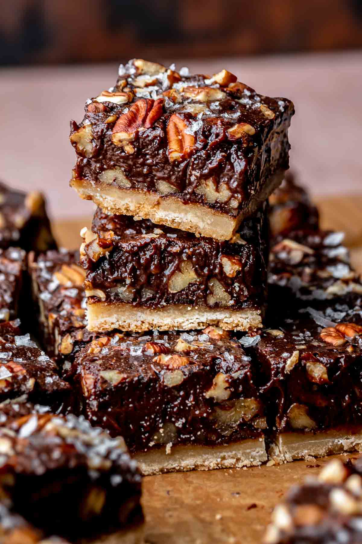 A stack of chocolate pecan pie bars.