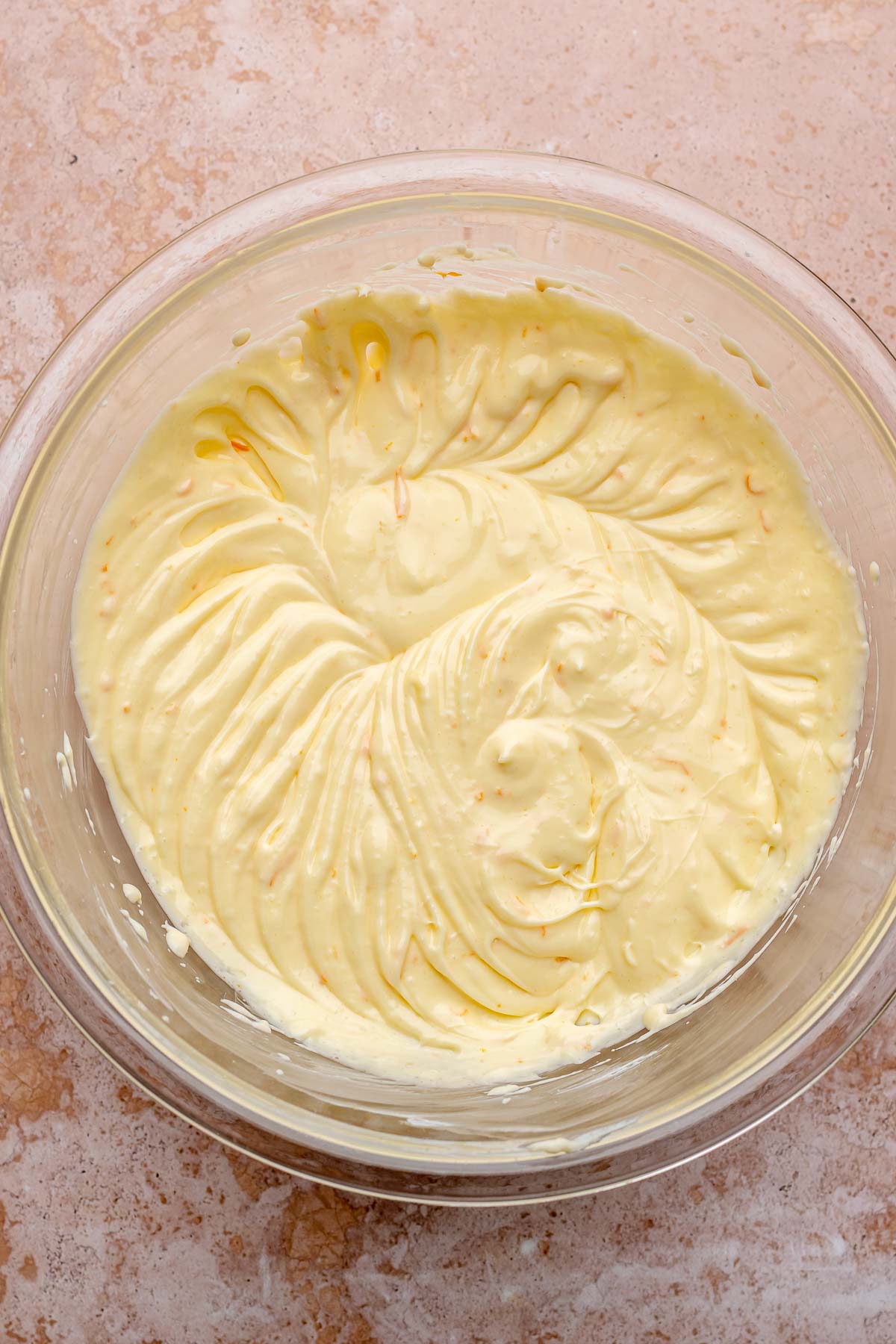 Beat cream cheese and eggs in a bowl.