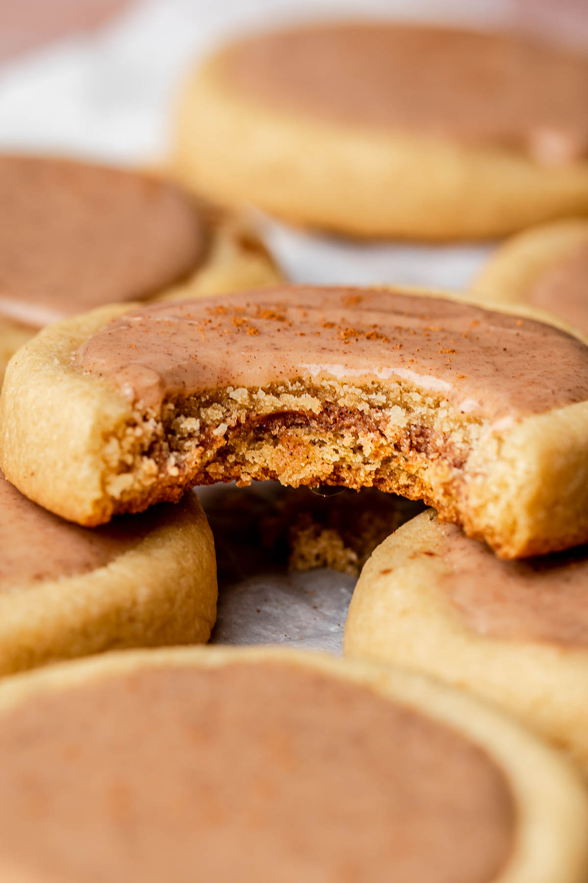 A brown sugar pop tart cookie with a bite removed.