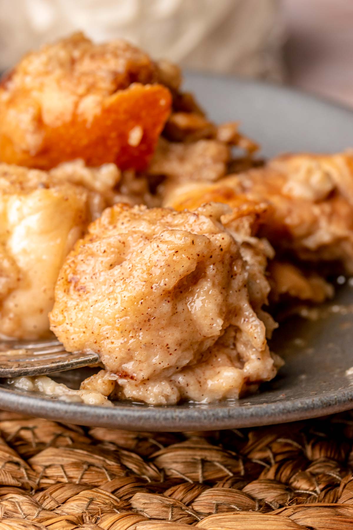 A piece of eggnog french toast casserole on a fork.