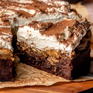 Sliced chocolate tiramisu cake on a platter.