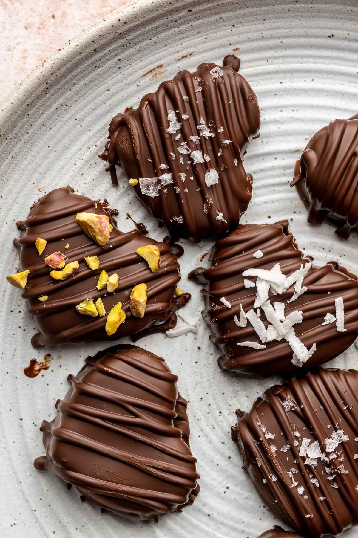 Heart shaped brownie truffles decorated on a plate.