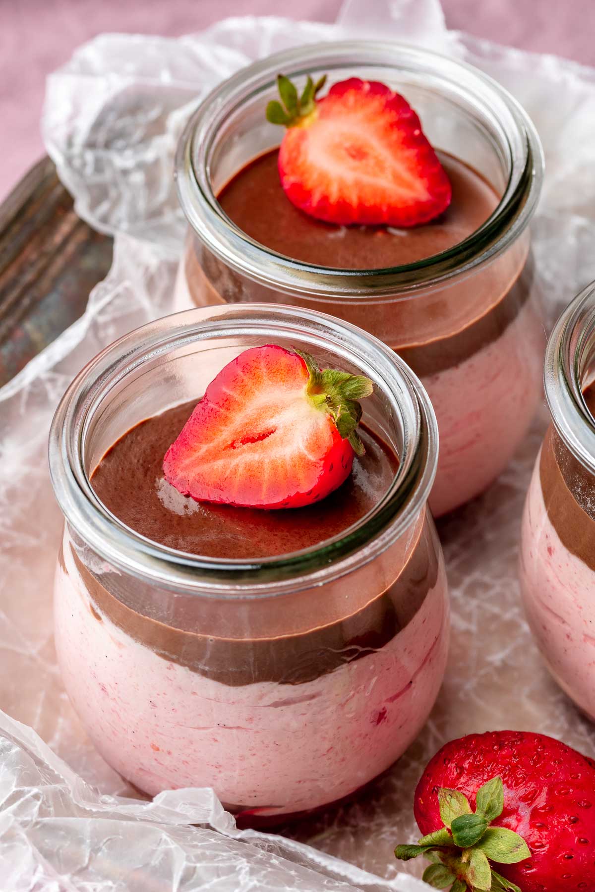 Chocolate strawberry mousse in a glass jar.