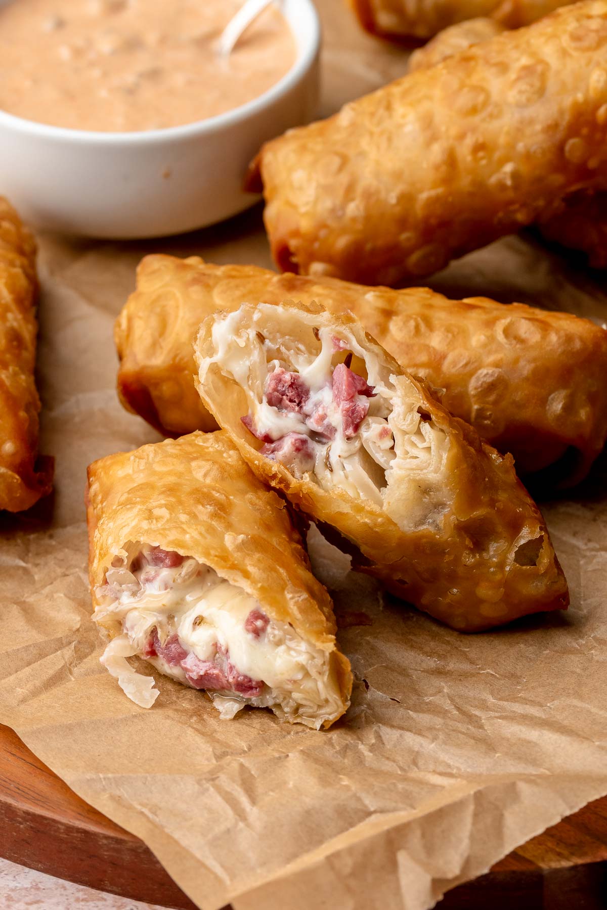 Reuben egg rolls cut in half to expose the center.