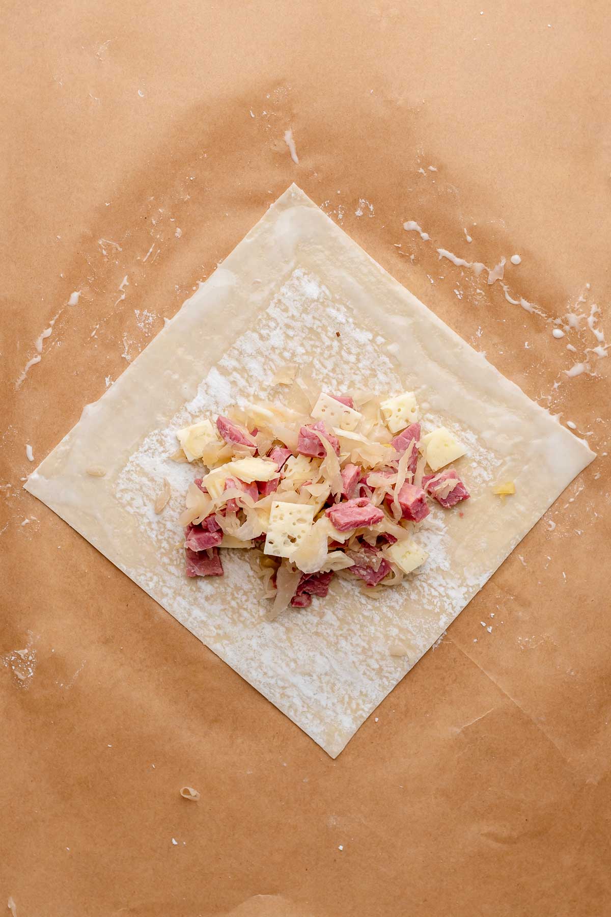 Egg roll filling in the center of an egg roll wrapper.