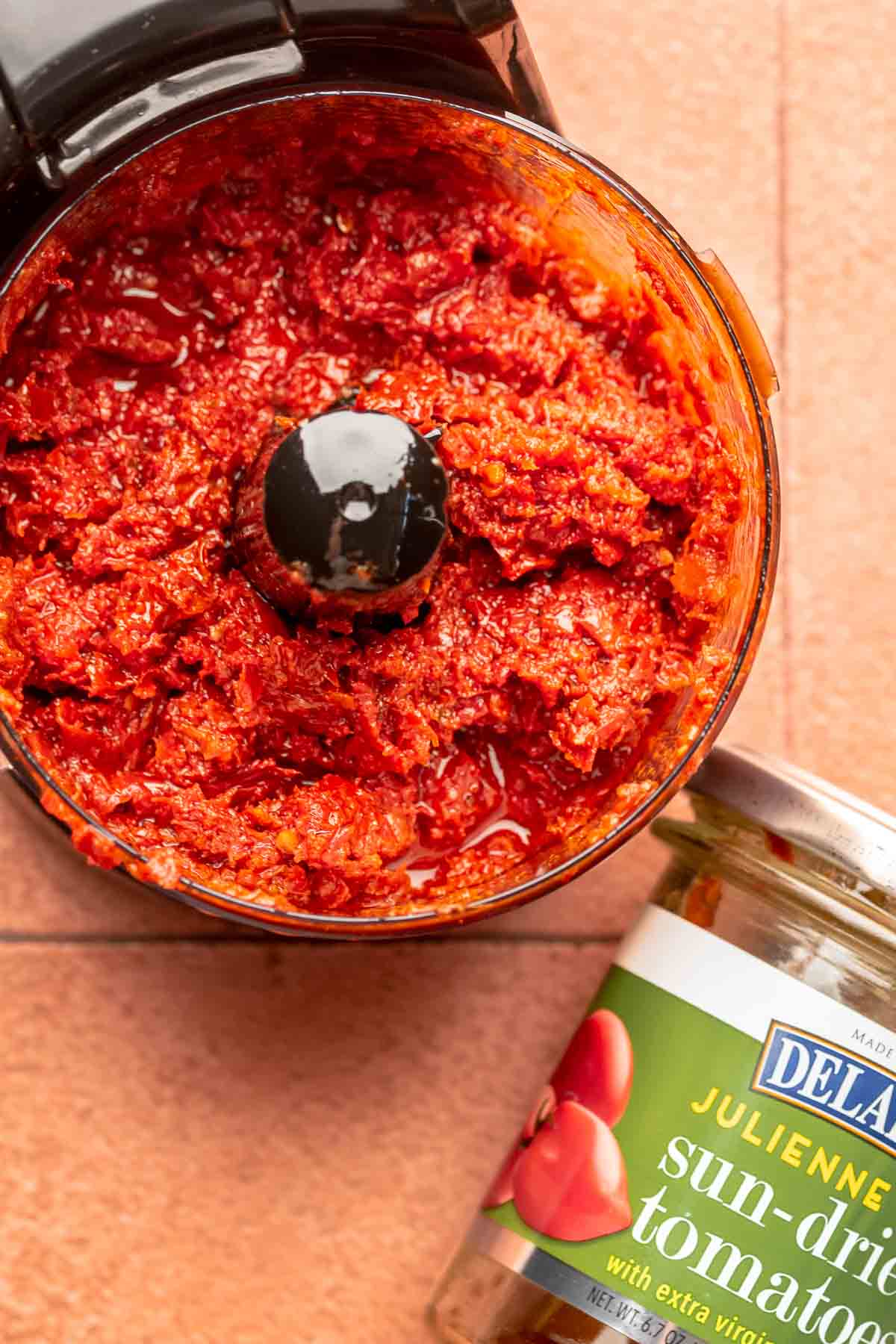 Pulverized sun-dried tomato dip in a food processor.