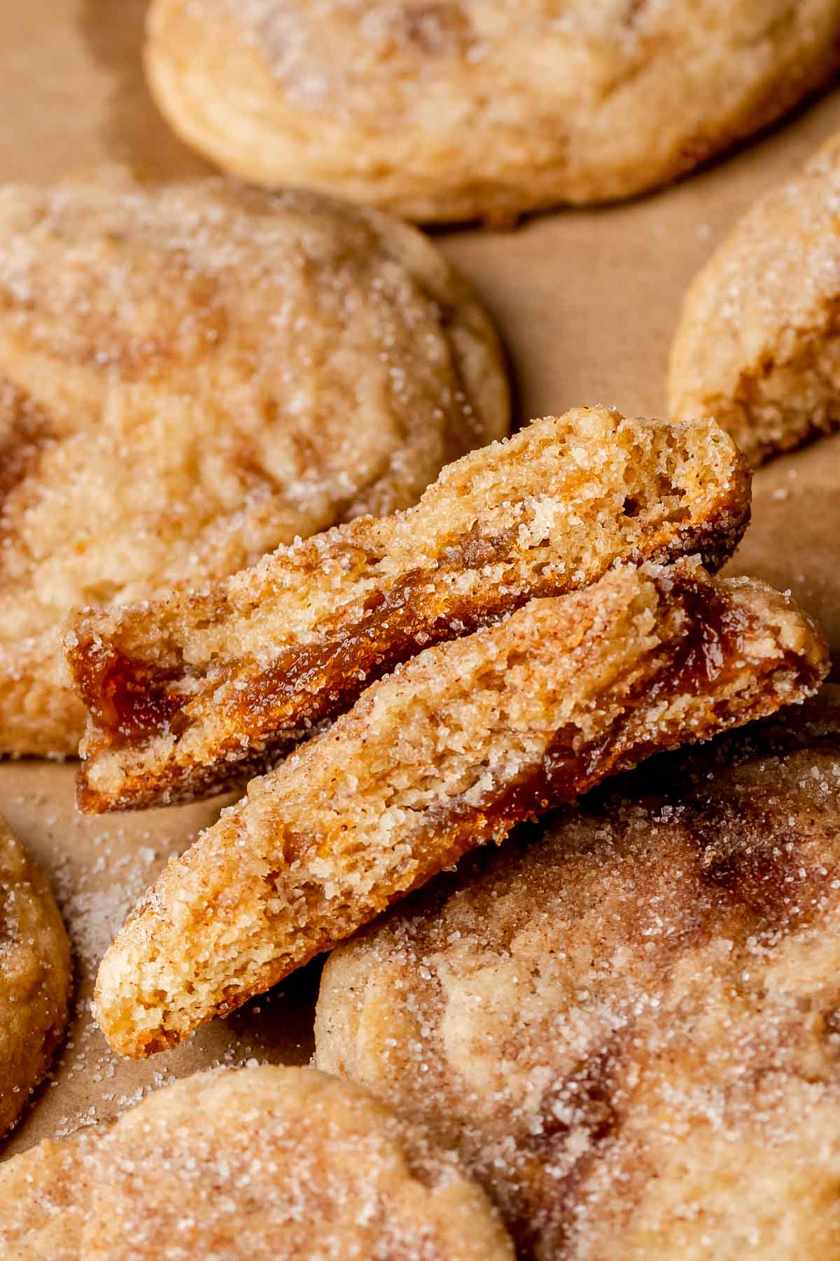 Apple butter cookies broken in half, sitting on top of each other.